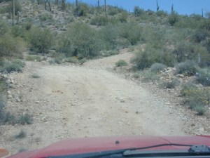 With a long, low vintage TT behind, this simple dip and turn on hardpack dirt has the potential to immobilize the entire rig, damage the hitch receiver, and/or cause structural damage to the trailer. Advice to self: try elsewhere.