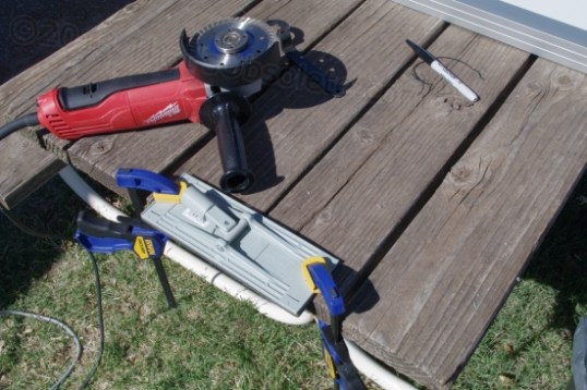 This is the picnic table being put to good use. Some of the protruding edge is removed with the grinder - carefully.