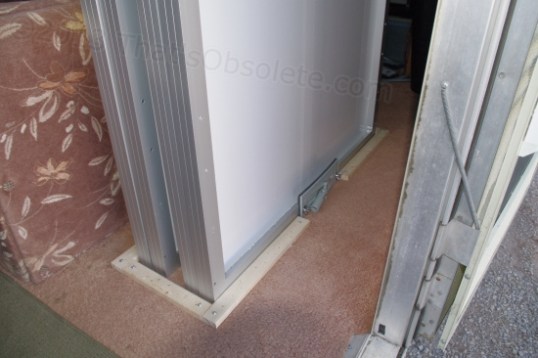 I suppose my next post will be about how I fitted the wood too closely and could no longer fit the frames inside, but it looks good right now. I had to venture 7 miles to find screws long enough to go through wood, carpet, and flooring, but it ended fairly well. Hopefully, I won't be reporting any short circuits or gas leaks in the near future.