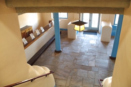 A view from the main floor staircase down into the Tap Room.