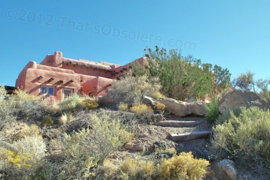 This is the Painted Desert Inn as viewed from a wilderness walking trail that winds below it down to the canyon floor.