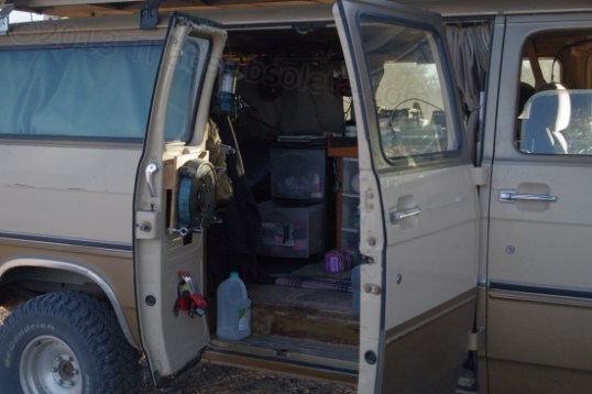 You have to be pretty committed to this style of living in order to be comfortable with it. You're looking into the stubby kitchen area, and the bed spans the back. Makes my 26' travel trailer seem mighty cushy in comparison!