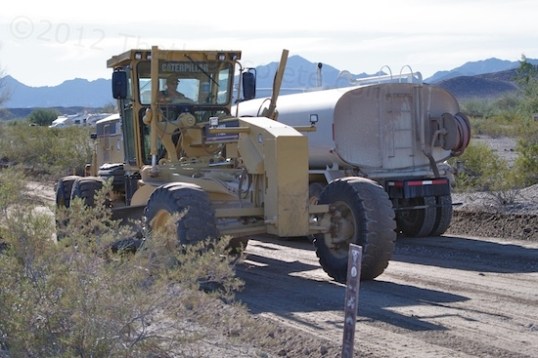 This was the last thing I expected to see when I got up this morning: a road grader and a water truck!