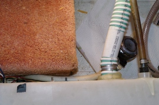 The black object on the right is the new mesh water filter, while the tubing supplying it is trapped on the left.