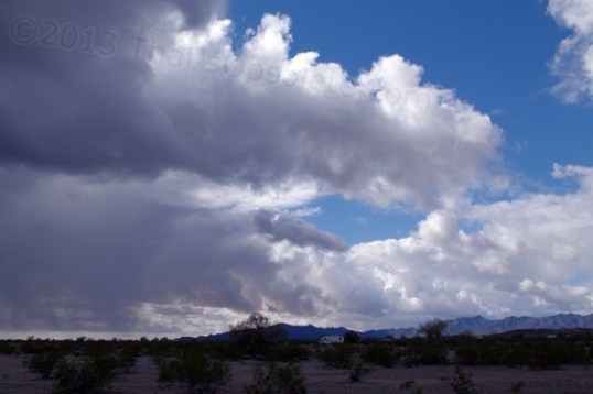 A look at the approaching sky. You can have rain from active clouds, yet plenty of bright blue sky, too.
