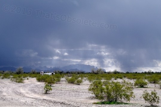 Rain about 10-15 miles away, to the left and right. The low clouds often skim through the tops of the mountains, and the rain comes and goes.