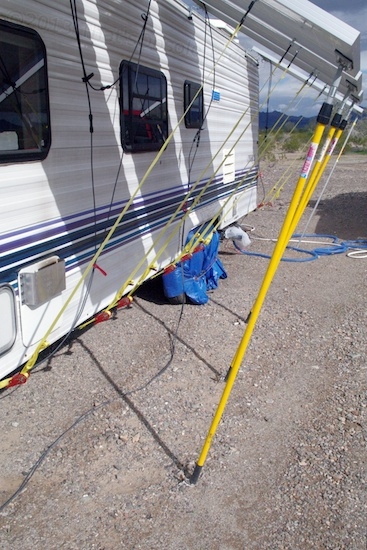 The poles really should go from panel to trailer instead of to ground, but there's no easy way to mount their bottom ends.