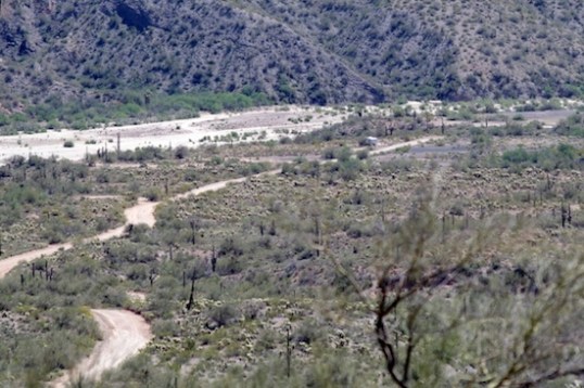 From the top of the hill, you can barely see the Enterprise, a tiny cube next to a tree, just to the right of center.