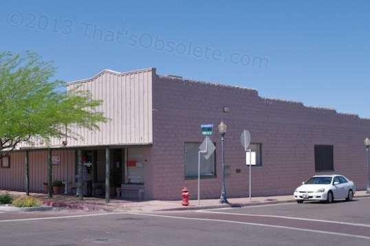 This 1918 building started as the Wickenburg Drug Company,, and then was Jones' Pharmacy. Then it was the Valley National Bank / Bank One from 1946-1995. It's made from molded cement blocks and is now a walk-in medical clinic.