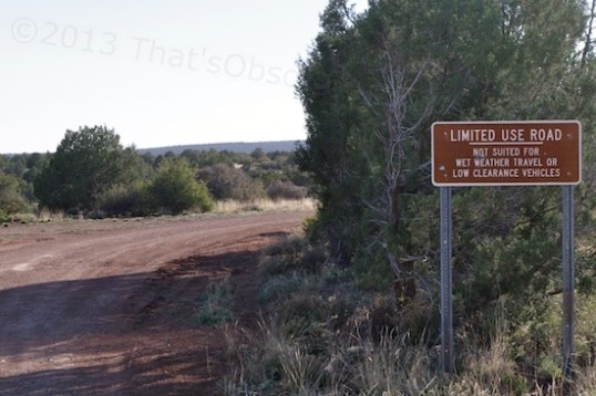 This sign basically warns that people with vintage travel trailers should think twice. Besides ground clearance problems, rain causes the dirt road to turn to mush.