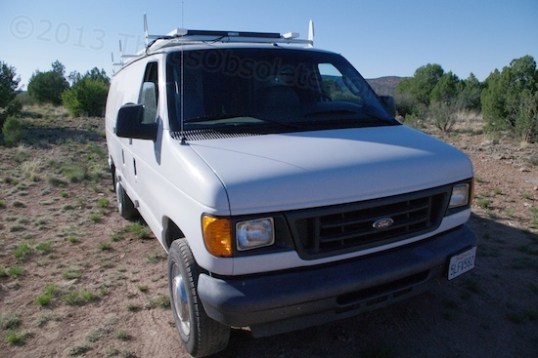 Mike ran the two solar panel output wires through the passenger door opening. It's the easiest approach by far, but will eventually deform the sealing gasket and might leak in the rain. That's just an "if" though, and it's worth trying in order to avoid drilling holes in the van's body.