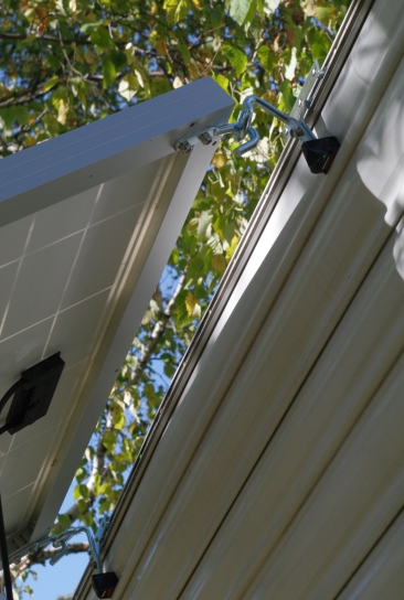 The shaft of the closer, trailer-mounted eyelet is bent down from the panel’s hook going in too far during over-horizontal use. Lowering the panel locked the parts together and easily bent the eyelet. It had to be replaced, and a fix cobbled up.