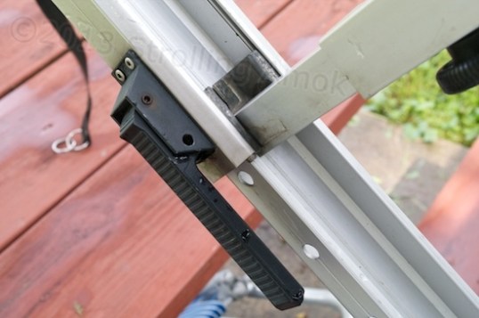 The awning has two of these telescoping arms. Yanking out the handle disengages a pin from a hole, and the arm can be retracted. Easy, yes?