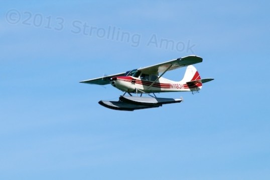 This plane, reputedly a Coast Guard aircraft,  goes down the beach once every day.