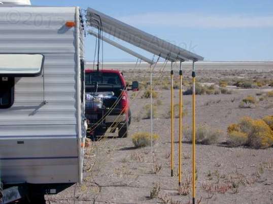 Those pairs of yellow ropes with hooks won't allow the panels to lift more than a few inches. I don't recommend this style of deployment with cheapie solar panels with weak frames. I like the color coordination with the poles, but it was just luck.