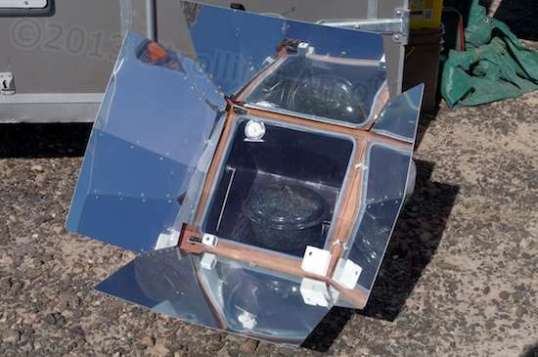 The solar oven in action: a pot allegedly full of beans & hamhocks.