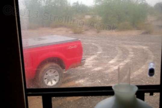 A shot out the wet dining area window early on Day 2 shows the same old thing. The gravel pad I'm on is raised, but still pretty mushy.