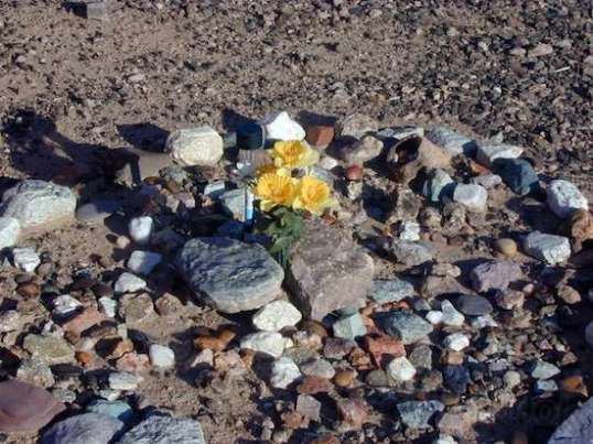 In Memoriam... the solar lamp is hard to see, but it's right next to the flowers on the left side.