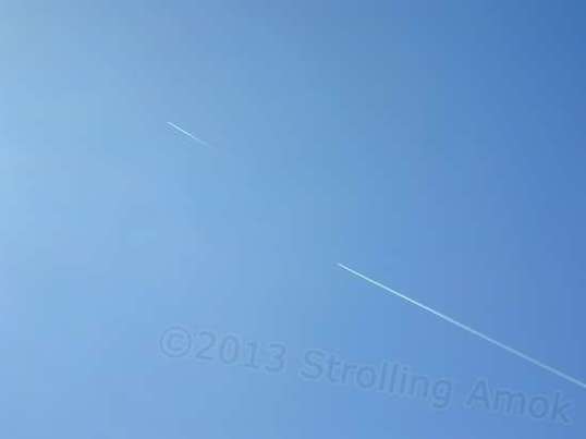 You occasionally see military aircraft of different sorts. I this case, it's two fighter jets, way up there.