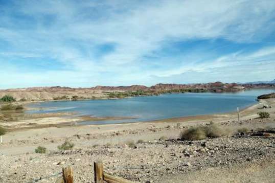 The shallow reservoir is actively used for irrigation, so the water level can drop or rise quite a bit on just one day.