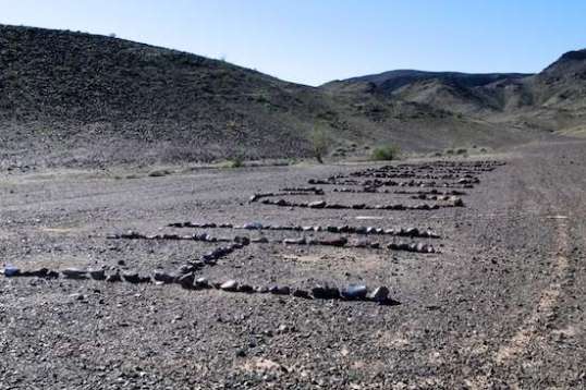 That big rectangle of rocks is actually a lineup spelling out "Hi Choppers". Several can be seen making the rounds throughout the entire area.