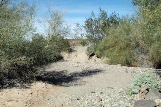 Oops, forget it! The far side climbout is steep and graveled enough to shift everything in the bed and pose a problem for the street tires. Once again, not a good idea to solo on.