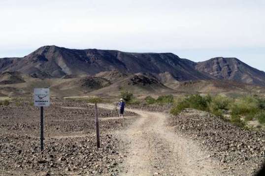 Stalker? Learned to teleport? It's the same lady on the same exercise walk. Considering that I need a nap after 2 miles, I'm not gonna challenge her to arm wrestling.