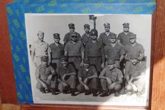 This picture, taped to Charles' pantry door, is a reminder. Of this, his squad, only two returned alive from Vietnam. The only other survivor died from an accident within two weeks of his return.