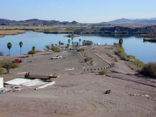 The boat ramp snakes down to right of center. Between its width and the size of the parking area, it's plain that it was designed for heavy usage.