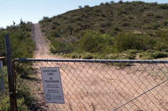 Many areas of State Trust land are leased out and locked up. This trail led to a huge water tank just over the hill. 