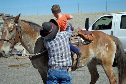 Up into the saddle he goes for a quick lap around first.