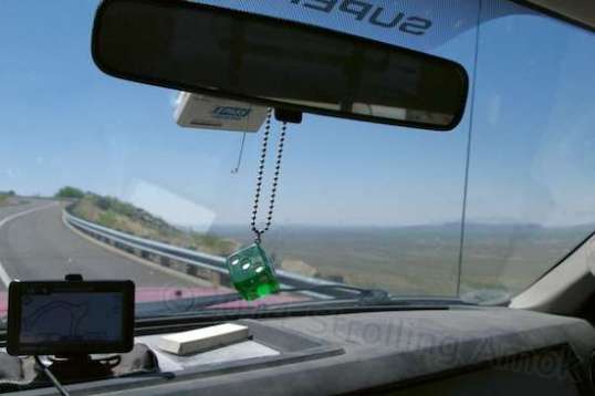 Well, besides highlighting my dusty dashboard, rearview mirror with unlucky die, GPS and expired I-Pass tollway gizmo, the other emphasis here is the rapid climb from Congress toward Prescott, AZ.