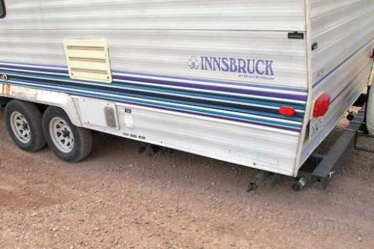 Answer: one skid was on the ground and the stabilizer it protects (just forward of it) was barely clear. When I whine about 10-1/2" of clearance on a 9-foot overhang, this is what I'm thinking of. Vintage TTs are like this. Fact of life.