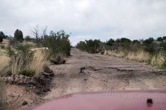 Looking into the south entrance, with the gate now open. Why's the pavement relatively intact down here, and gone further north? The south entrance requires high clearance, but not 4WD.