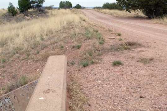 While I marveled at the apparent loss of pavement, I also wondered if dirt and gravel had been dumped on top, making it look worse than it was.