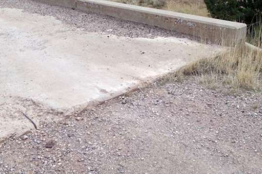 This was by far the most beat-up overpass, and the only one with a step-up to get to it. I would have voted for most of Old 89 having been left unpaved...