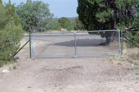 The gate associated with this entry is far enough away from the road to allow  getting completely off the new highway to get in.
