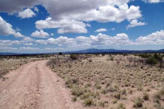 This is the view back toward camp from an "illegal" gate entry that is wired shut. Then I noticed that the wire loop was configured to swing up and clear. Hmmm. That baby chopped 5 miles off the official entry further north, and 10 minutes of fuel off the rough south entry. I'm not admitting I took it...just stating it's theoretical effect. Yeah.