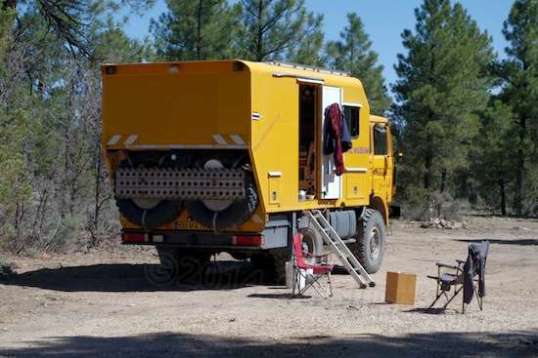 Walking back from town - with my bike - I saw this truck-based camper that had remained there for several days. I'd seen European trucks like this servicing the Dakar Rally, but never one "in person". 4x4. Look at the size of those spares! Heavy enough for you?