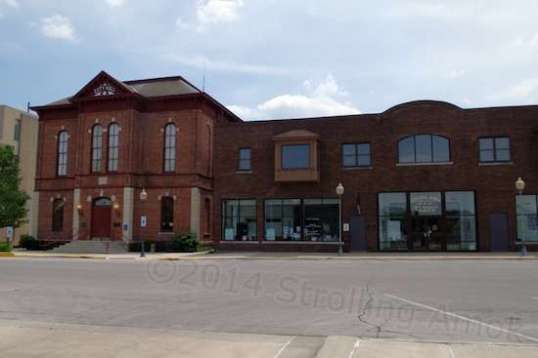 The original city hall and courtroom is now an opera house (left), while all the city offices moved next door.