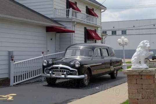 Part of its charm is a 1954-ish Packard hearse parked alongside and ready to serve. Until my time comes to go the way of all the earth, I'd still like a ride - in front - if it's all the same to you.