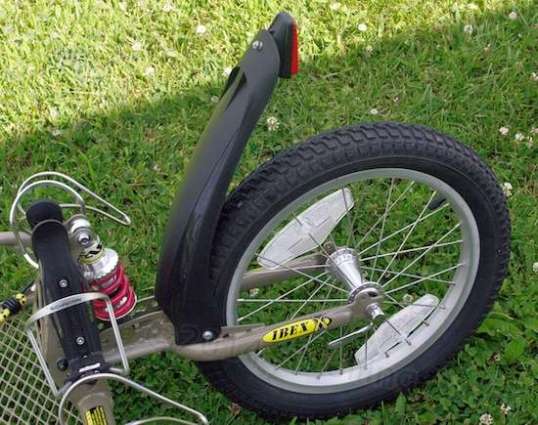 BOB calls that black thing a fender. It's ugly parading as stylish. It is guaranteed not to prevent a rooster tail of dirty water from depositing a skunk stripe of filth over your cargo. I have yet to locate a bolt-on solution to this.