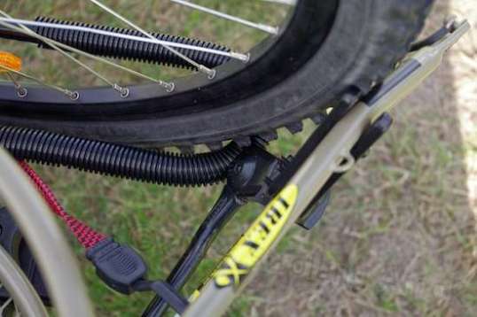 A piece of tape on the trailer fork helps protect its paint from the bike's front tire.