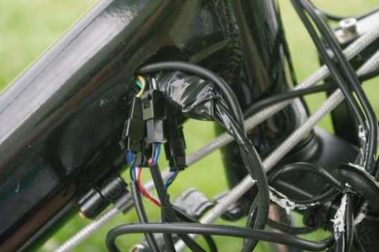 Coaxing the wires out of the frame to give more available length wasn't that difficult, and I began wrapping the internal connectors with tape while I was at it.