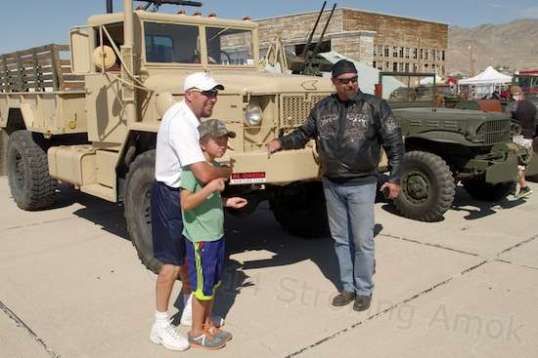 What are they pointing to? A sticker that says "Al Qaeda Hunting Club". Humor with a point.