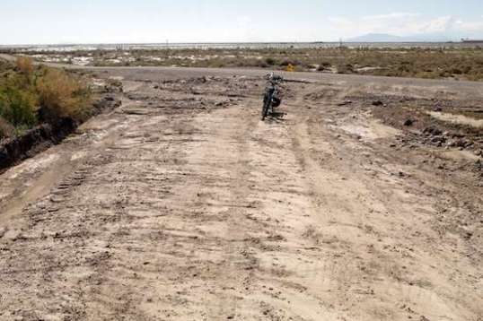 Same intersection from another direction, bike in the same place. Gee, it just looks like I could motor the rig right out there, doesn't it? Nope. Either hug the left and run parallel to ease it up, or ground it solid and flex the chassis rails, at best.