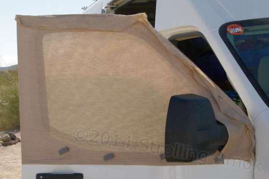 This shade cloth makes a decent window sock that lets in air while keeping out bugs. Richard places the seam outside so as not to traumatize the door gasket when closed.