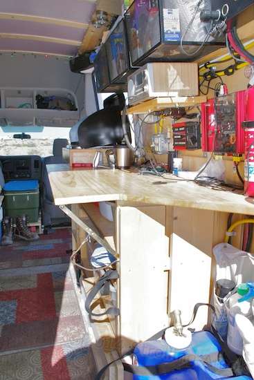 The passenger side from the back end shows the work/kitchen table a little better. The projecting section folds down out of the way.