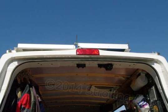 A shot of the improvised roof rack, solar panels to the center and left.