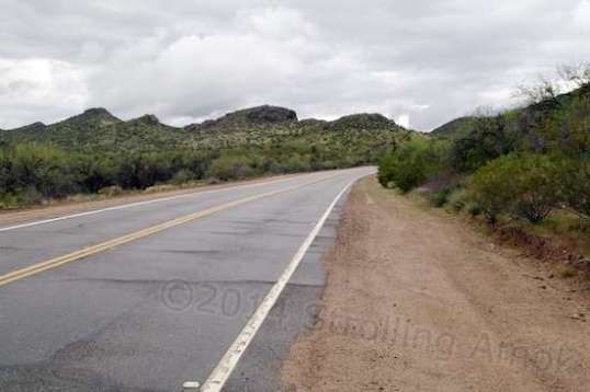 This is the highway that the entrance abuts. No doubt it was once a trail, then a wider trail. Now its an ample two-lane with wide, groomed shoulders.